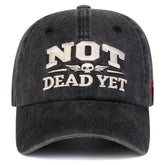 Unisex NOT DEAD YET Embroidery Wash Baseball cap features bold embroidery on a stylish black design.