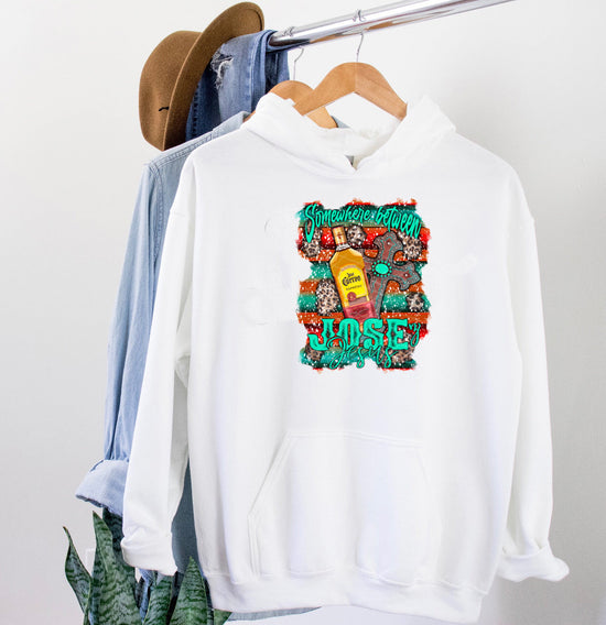 Somewhere Between Jose & Jesus - w Serape Leopard & Cross white hoodie displayed with casual clothing